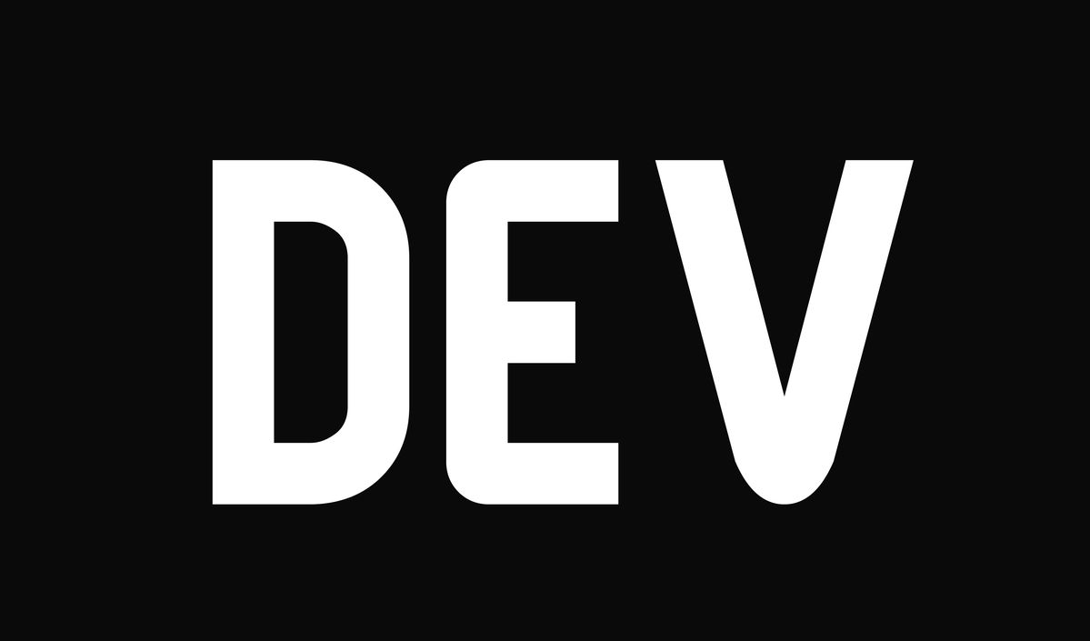 Developer typing code on a laptop with multiple browser tabs and a terminal window open